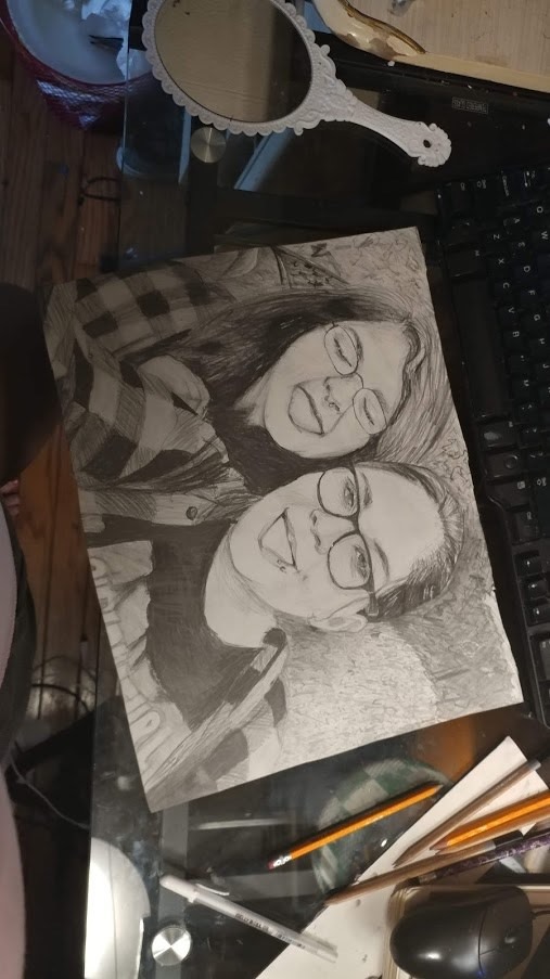 A pencil portrait of two of women.