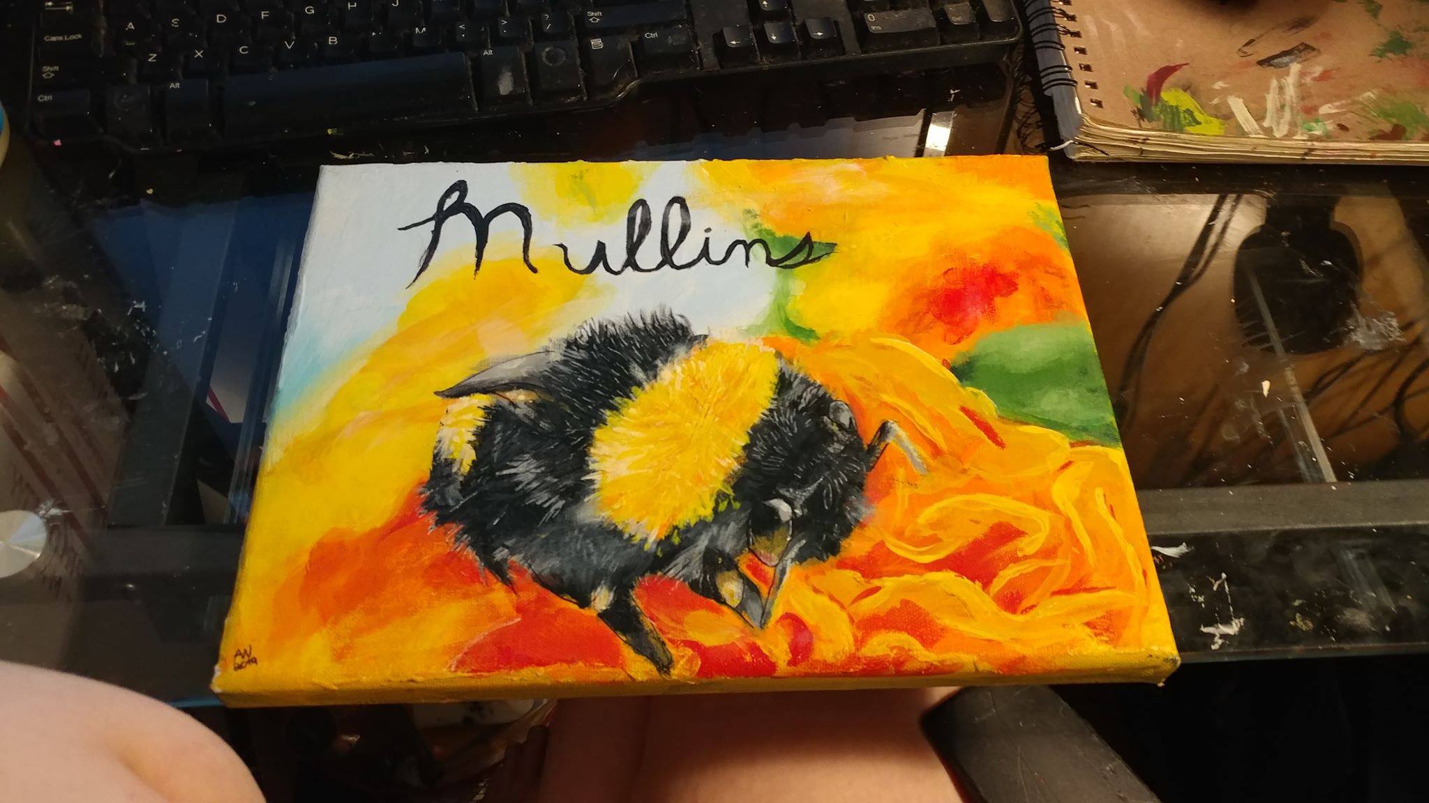 Painting of a bee on flowers on a canvas.