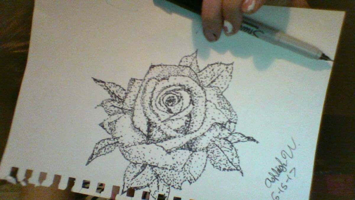 A digital illutration of mountains behind water in front of a sunset