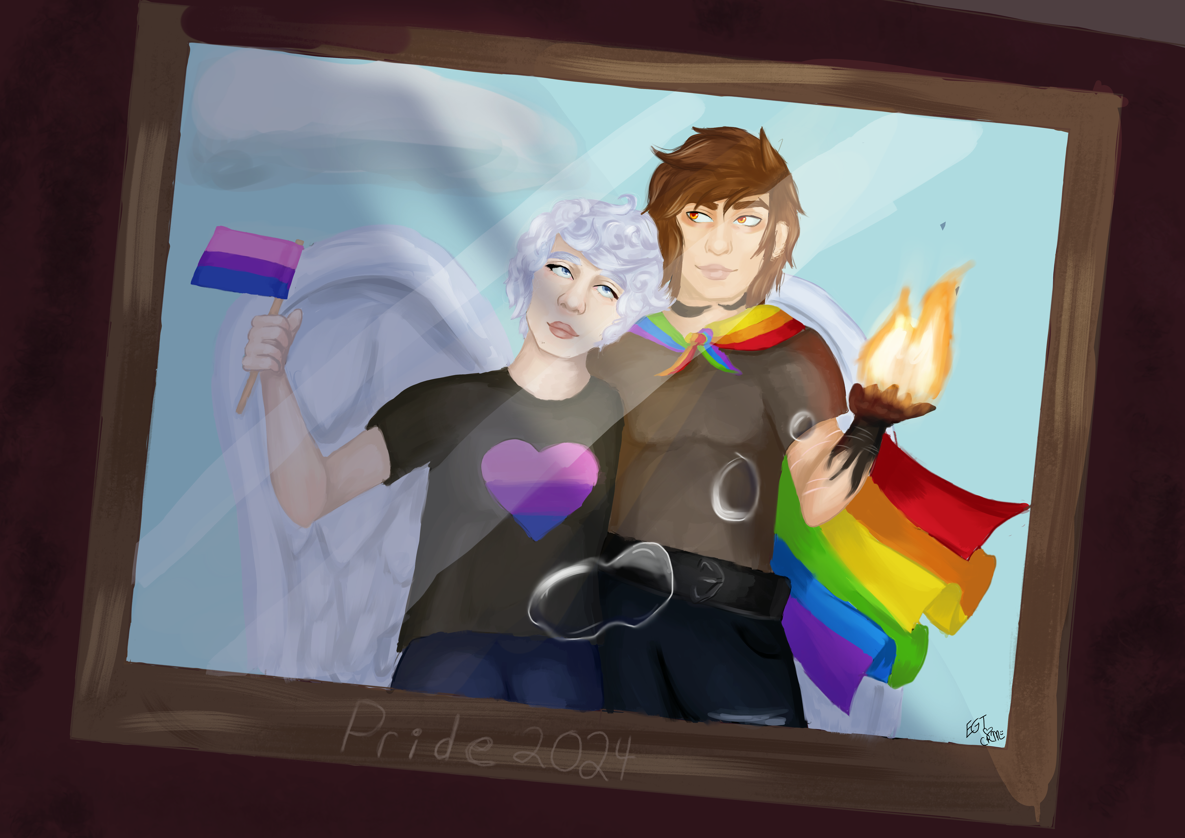 Two men in a photo frame, one is wearing a rainbow pride flag as a cape, the other has a small bisexual pride flag in his hand and his sheart has the flag in the shape of a heart.